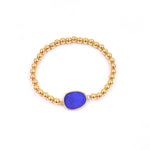 Ashley Gold Stainless Steel Gold Plated Center Semi Precious Center Stone Ball Beaded Stretch Bracelet